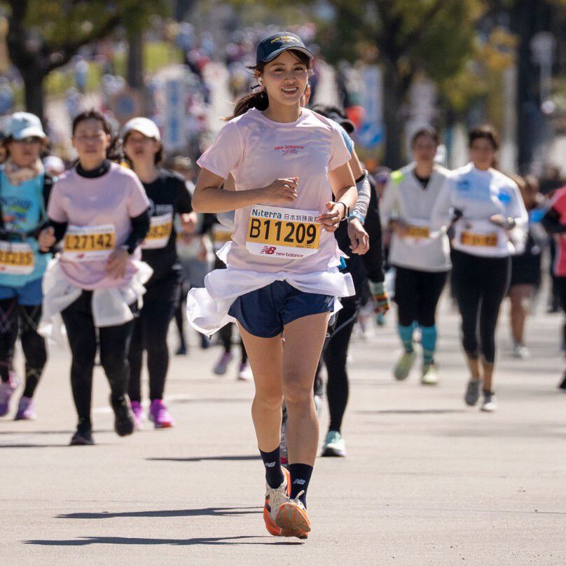 A woman running a race.